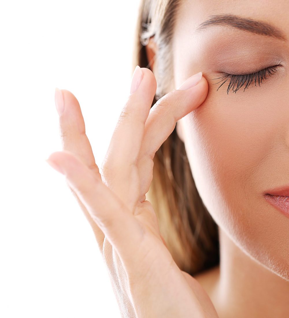 Woman with eyes closed after eyelid surgery